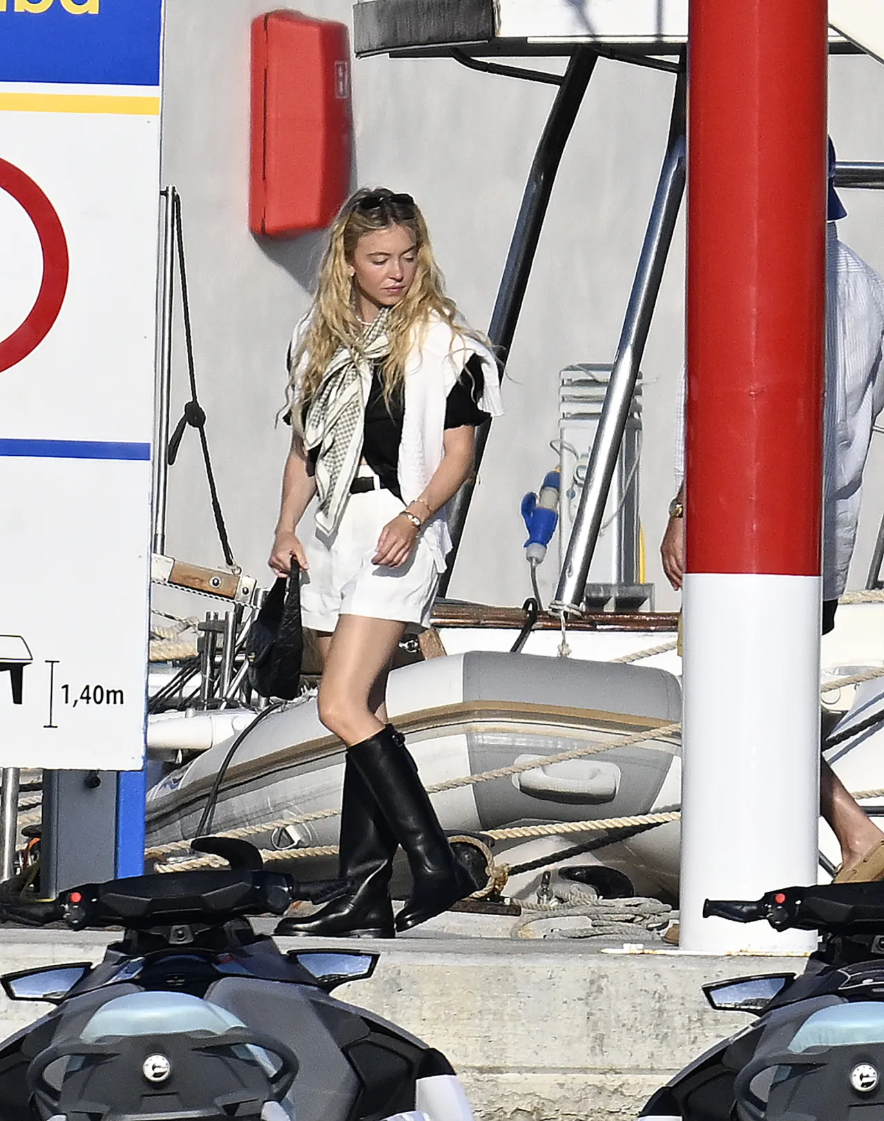Sydney Sweeney Black Boots and White Shorts in Palma – August 16, 2026